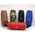 Red textured fabric wireless bluetooth speaker with black carrying strap and jbl logo for bluetooth audio