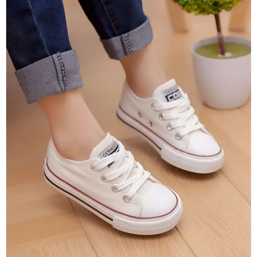 White canvas red toddler casual shoes student style with black and red rubber soles and silver eyelets for children’s clothing