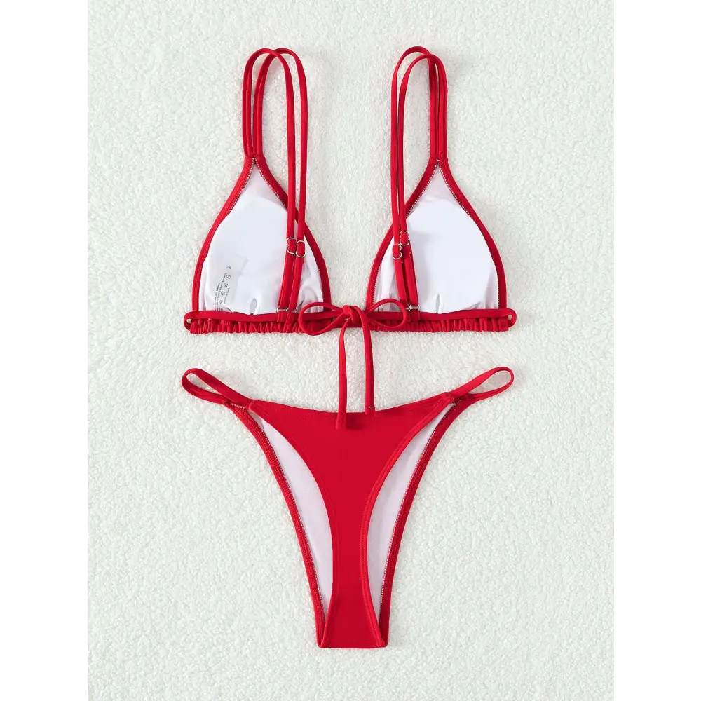 Red and white triangle cup halter bikini set with thin straps and ruffled edge features a stylish halter bikini design