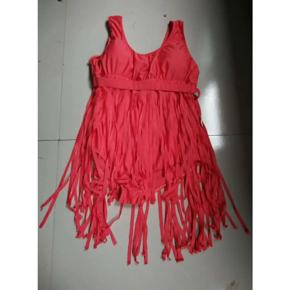 A vibrant red triangle slimming plus size fringe swimsuit with a fitted bodice and flowing tassels