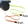 Black retractable double dog leash with neon green and orange woven straps and silver metal clips for walk two dogs
