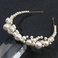 Delicate gold retro bridal headdress featuring a simple pearl headband with clusters of white pearls in varying sizes