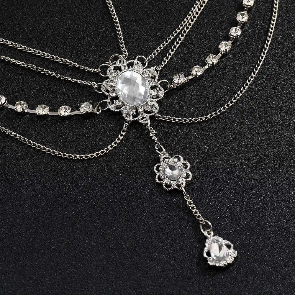 A silver retro diamond embellishments flower drops headpiece with rhinestones, central oval crystal, and dangling charms