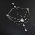 Silver ornate flower drops headpiece with retro diamond embellishments and central oval gemstone detailing