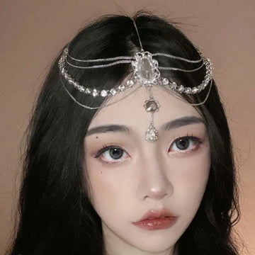 A silver retro diamond embellishments flower drops headpiece with rhinestones, central oval crystal, and dangling charms