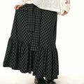 Black and gray checkered fishtail skirt with matching ruffled plaid tiers for retro elegant style