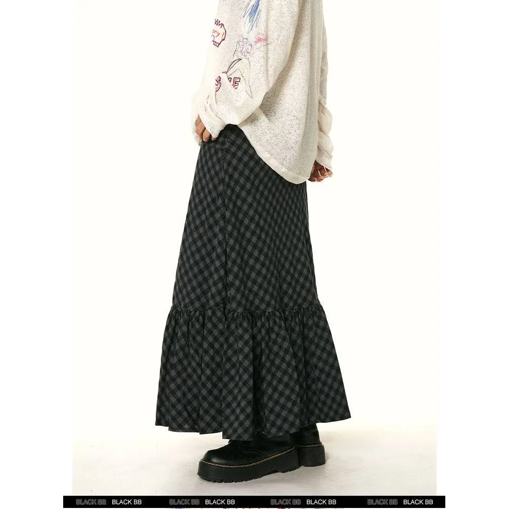 Black and gray checkered tiered maxi fishtail skirt with matching ruffled plaid and ruffled hem for retro style
