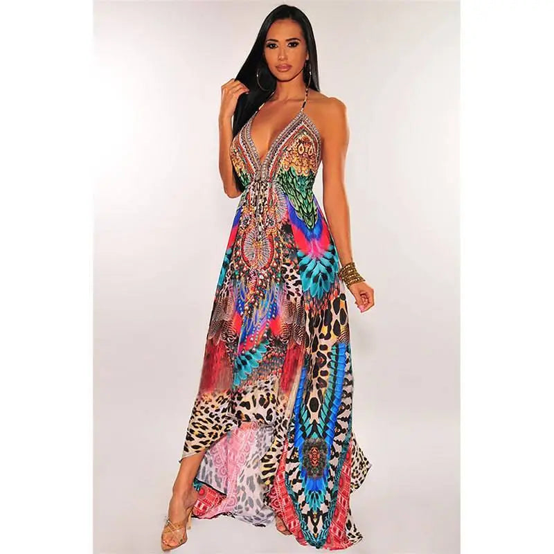 A vibrant retro pattern sexy halter dress with leopard print and bold feather and geometric designs in turquoise pink red and gold