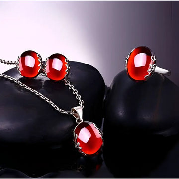 Retro red zircon s925 sterling silver jewelry set featuring oval translucent ruby-like stones in intricate silver filigree