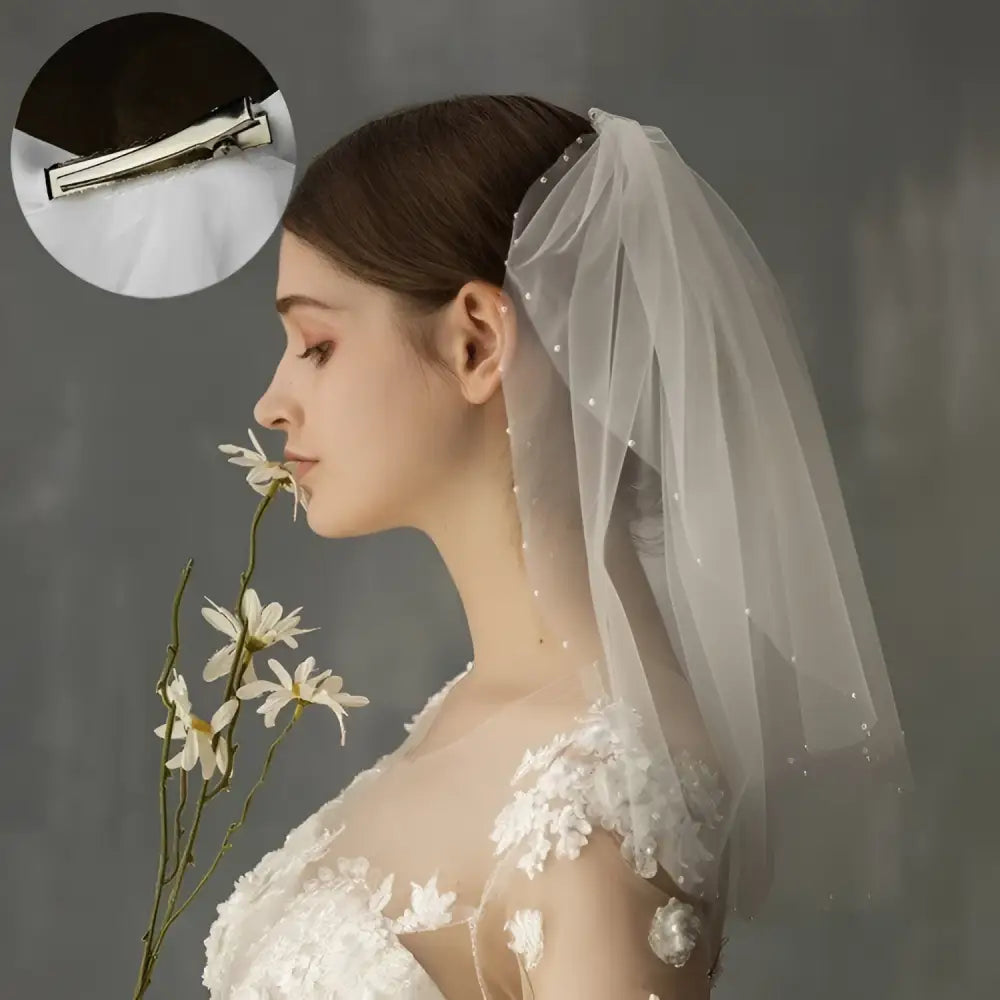 Retro short wedding lace floral veil in white tulle with pearl embellishments and a sleek silver hair clip