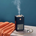 Navy blue retro vinyl single spray humidifier with a glowing led grid and vinyl record design on the front