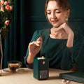 Dark green rectangular retro vinyl navy blue single spray humidifier with perforated front panel and circular button on top