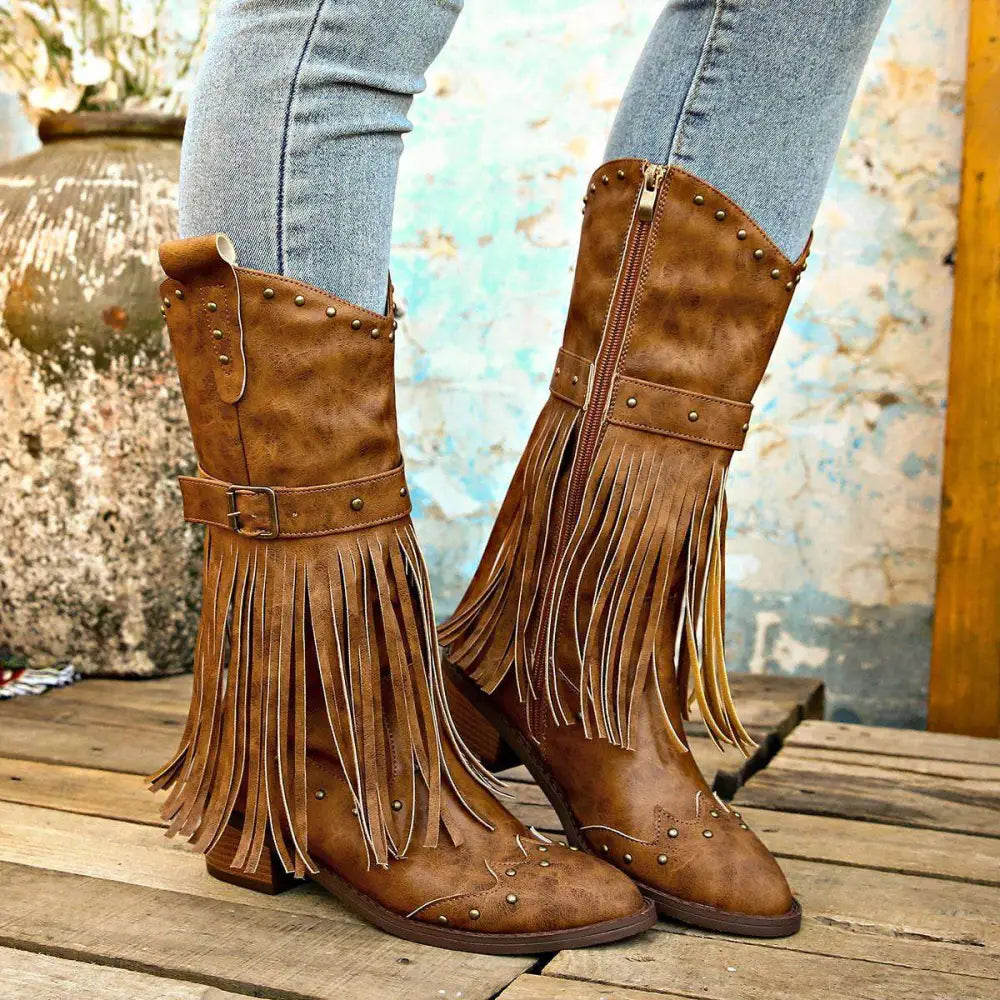 Retro winter fashion brown suede cowboy boots with fringe and gold-tone studs designed for stylish cold weather wear