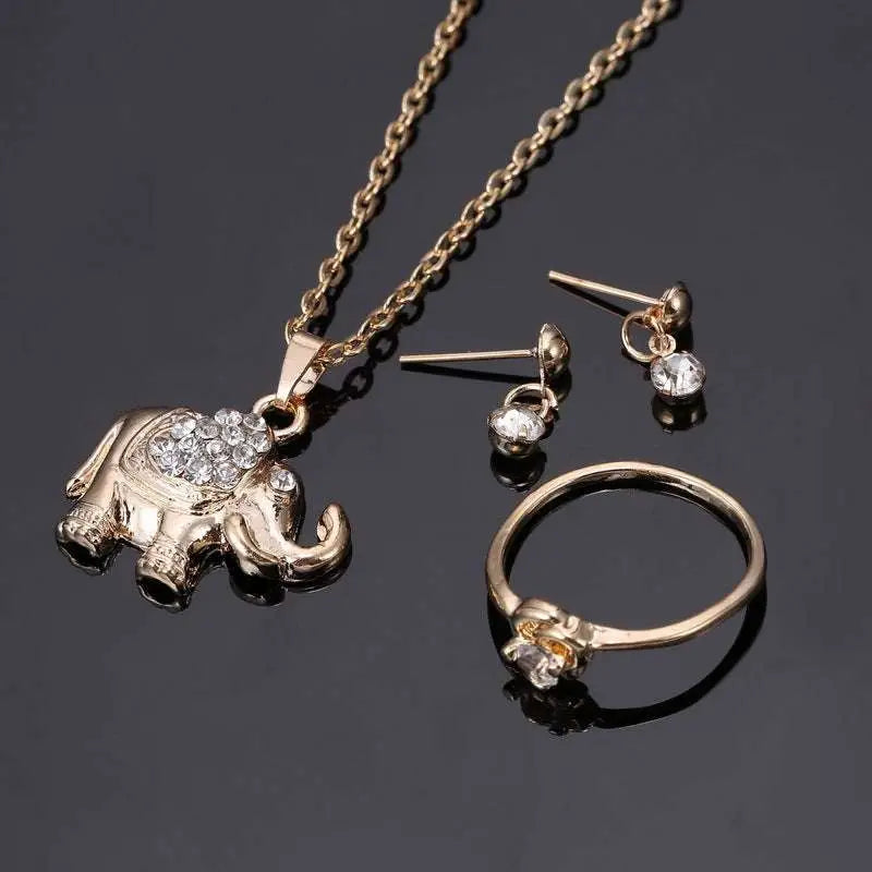 Gold-toned rhinestone elephant necklace with matching earrings and ring featuring a central gemstone yiwu small commodity