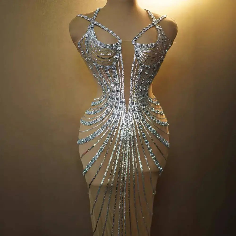 A shimmering silver rhinestone feather dress banquet gown with intricate sequins and a feathered hemline