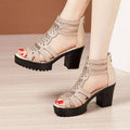Beige rhinestone fish mouth medium platform sandals with black chunky heel and red polished nails visible