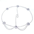 Silver rhinestone headdress featuring a drop bridal chain design with decorative floral clusters for bridal wear