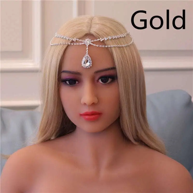Gold-colored rhinestone headdress with sparkling crystals and a dangling teardrop gem drop bridal chain for bridal use