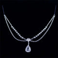 A silver rhinestone headdress featuring a sparkling double-strand drop bridal chain with a teardrop pendant