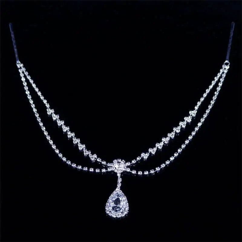 A silver rhinestone headdress featuring a sparkling double-strand drop bridal chain with a teardrop pendant