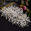 A silver rhinestone leaf handmade bridal headband adorned with clear crystals pearls and intricate leaf designs