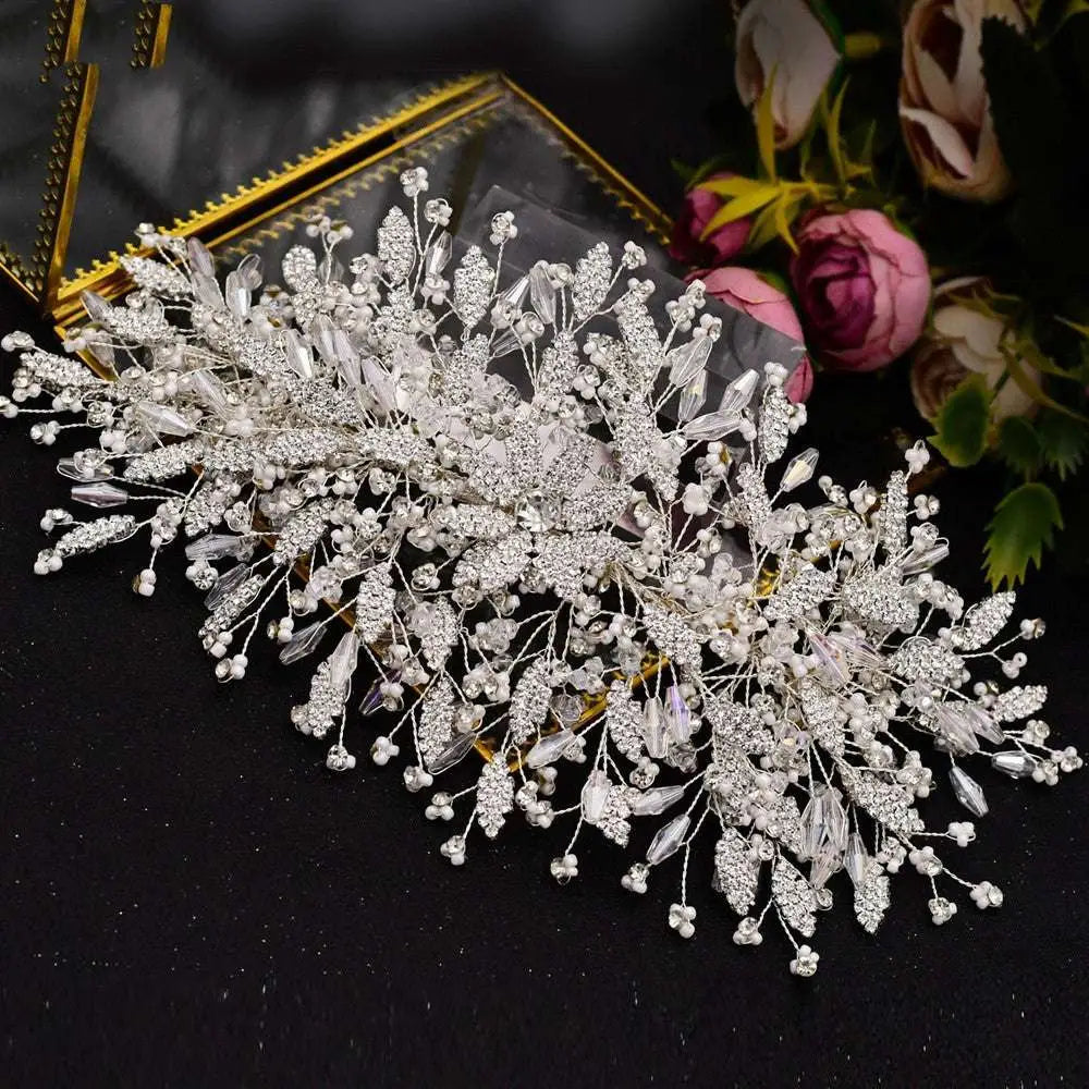 A silver rhinestone leaf handmade bridal headband adorned with clear crystals pearls and intricate leaf designs
