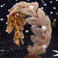 Gold leaf-shaped silver rhinestone leaf handmade headband adorned with sparkling rhinestones and white pearls