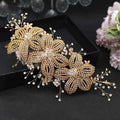 A delicate gold-toned rhinestone leaf handmade headband adorned with sparkling crystals for bridal use