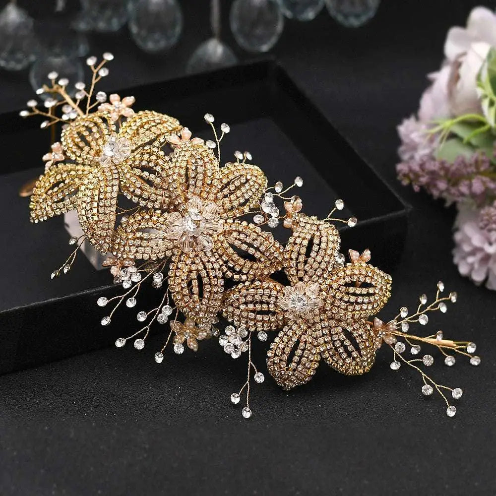 A delicate gold-toned rhinestone leaf handmade headband adorned with sparkling crystals for bridal use