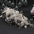 Silver rhinestone leaf handmade headband and earring set with sparkling floral design for bridal use