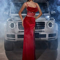 A striking red velvet pendant collar sling party dress with a draped bodice and sparkling rhinestone velvet pendant embellishments