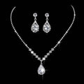 A sparkling silver rhinestone zircon water drop necklace with matching drop earrings adorned with clear crystals