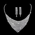 A dazzling silver rhinestone zircon water drop necklace with cascading tiers and matching drop earrings set
