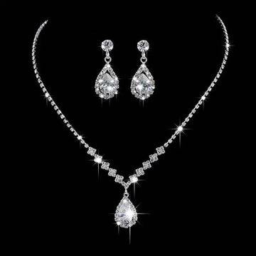 A sparkling silver rhinestone zircon water drop necklace and matching drop earrings set adorned with clear crystals