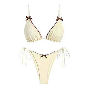 Cream-colored ribbed bikini set with brown bow accents on straps and center perfect for beige swimwear trends