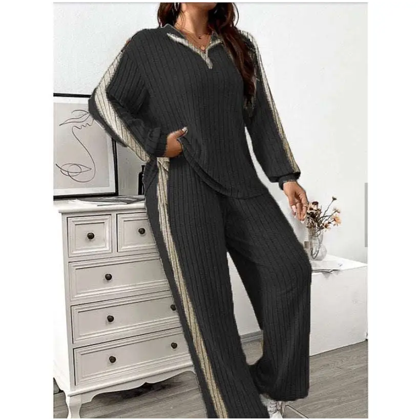 Black ribbed knit striped two-piece loungewear set with beige ribbed knit and gray side panels wide leg pants