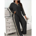 Black ribbed knit striped two-piece loungewear set with beige ribbed knit and gray side panels wide leg pants