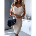 Black leather Dior saddle bag with gold-tone hardware paired with ribbed knit sleeveless top and tight suspender skirt fashion autumn