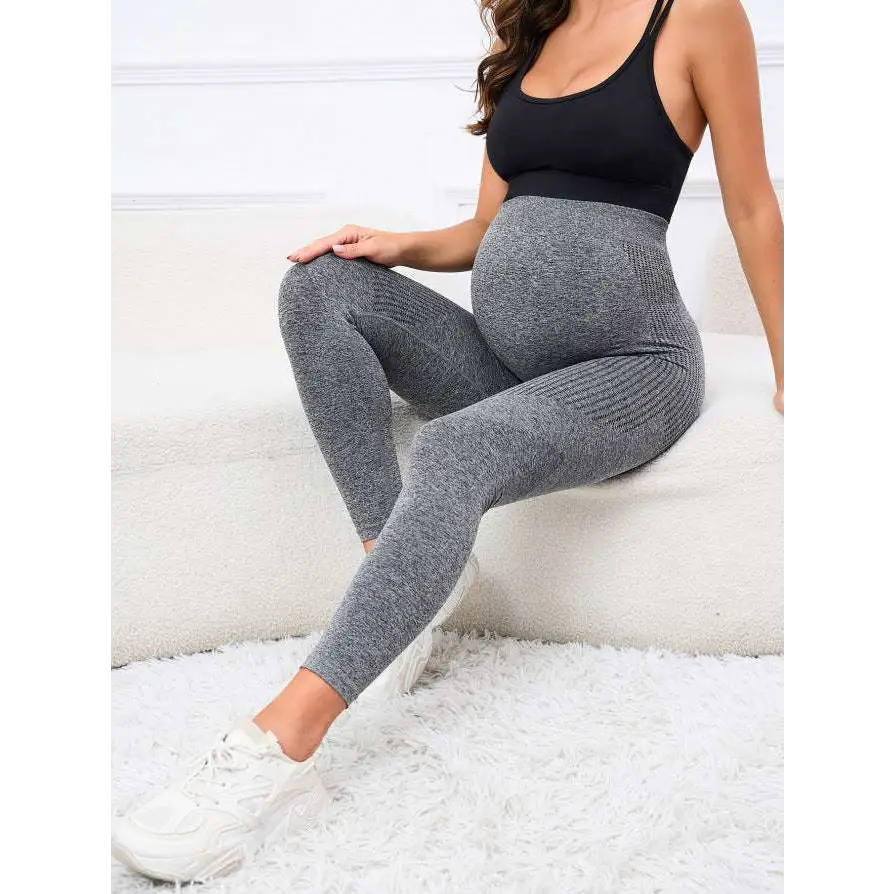 Gray ribbed maternity leggings with high waist belly support worn by a pregnant woman for comfort and flexibility