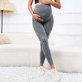 Gray ribbed maternity leggings with a stretchy form-fitting design and belly support high waist for pregnancy comfort