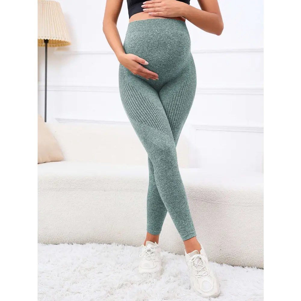 Moss green ribbed maternity leggings with high waist belly support made from stretchy fabric for comfort