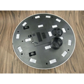 Black circular robot household automatic sweeping machine base with white trim and reflective rectangular stickers
