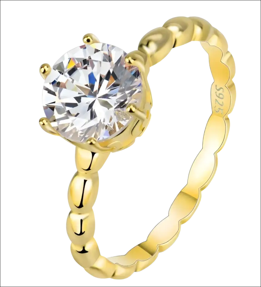 Rose gold beaded sterling silver ring with a round-cut gemstone in a six-prong setting and scalloped band design