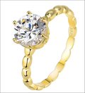 Rose gold beaded sterling silver ring with a round-cut gemstone and ornate scalloped band in sterling silver