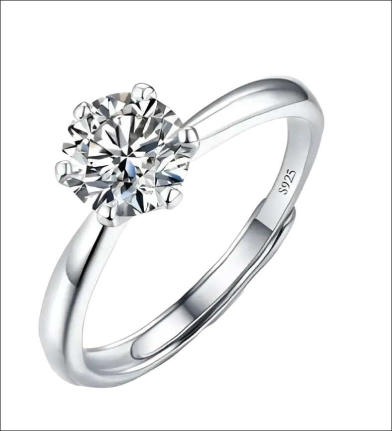 A sleek silver sterling silver ring featuring a brilliant-cut diamond solitaire held in six prongs