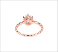 Rose gold beaded sterling silver ring with a central round-cut gemstone set in an ornate silver band