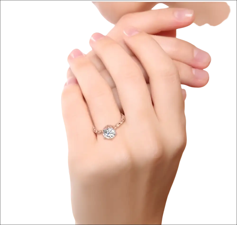Rose gold beaded sterling silver ring with central round diamond halo setting and intricate sterling silver design