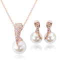 Rose gold bridal pearl necklace and earrings set with large white pearls and crystal-encrusted gold bridal pearl frame