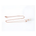 Rose gold bridal pearl necklace with crescent moon pendant featuring sparkling crystals and a single white pearl