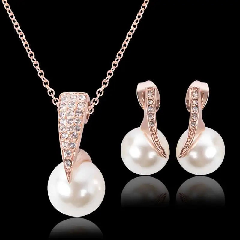 Rose gold bridal pearl necklace earrings set with diamond-encrusted pendant and matching white pearls for weddings